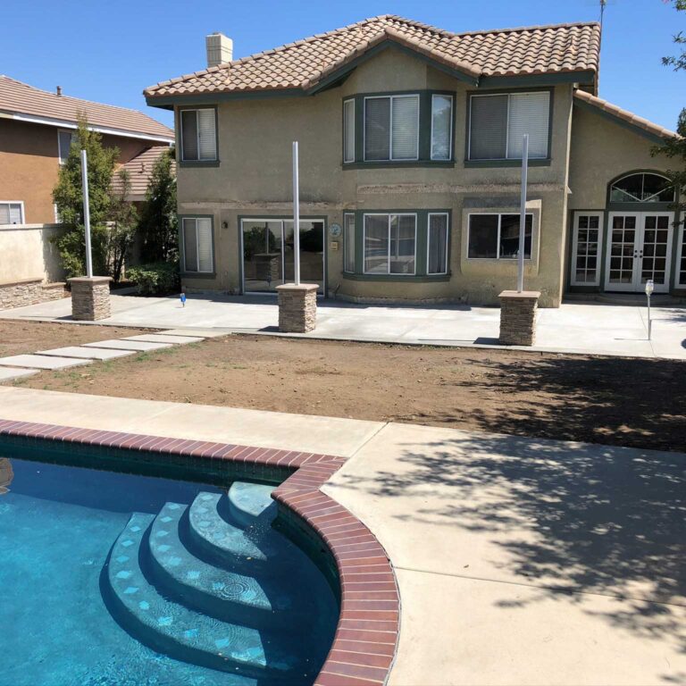 A large pool with steps leading to the side of it.