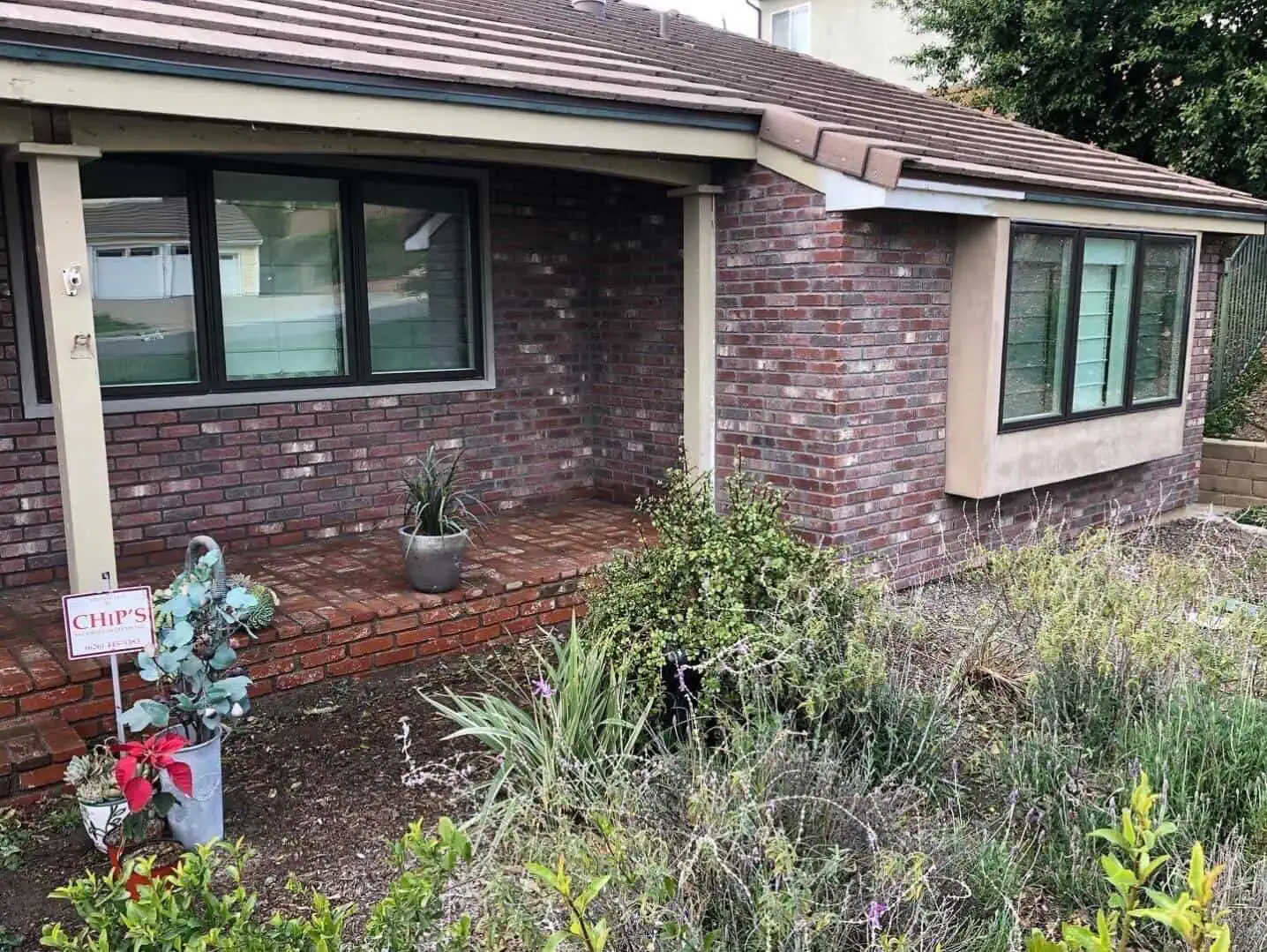 A fire hydrant in front of a house.