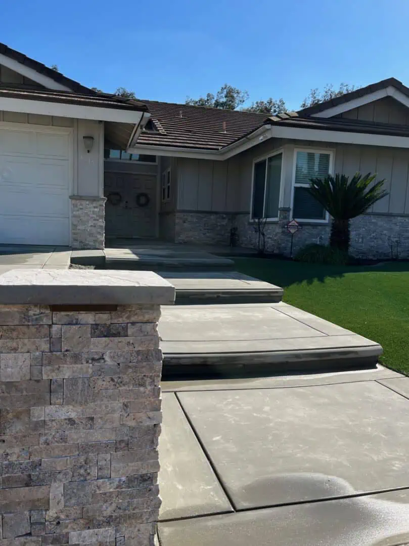 A house with steps leading to the front door.