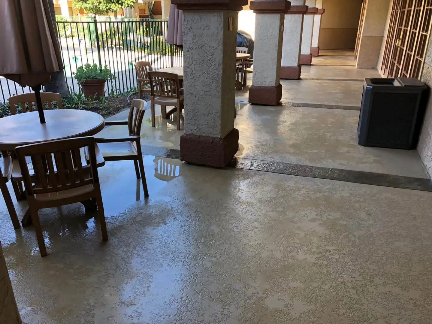 A patio with tables and chairs in it