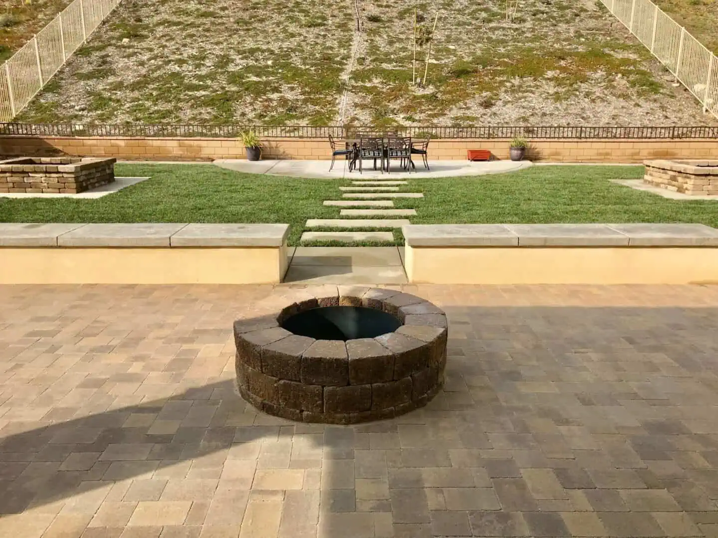 A fire pit in the middle of an outdoor area.