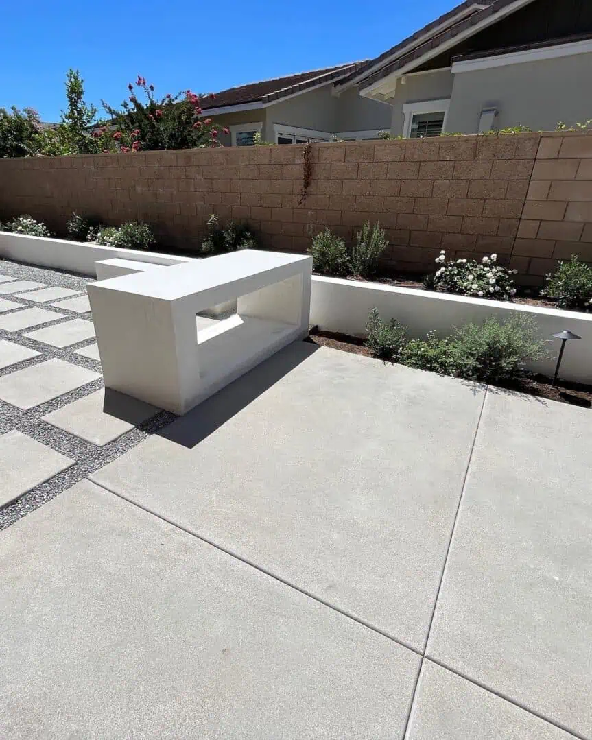 A bench sitting in the middle of a patio.