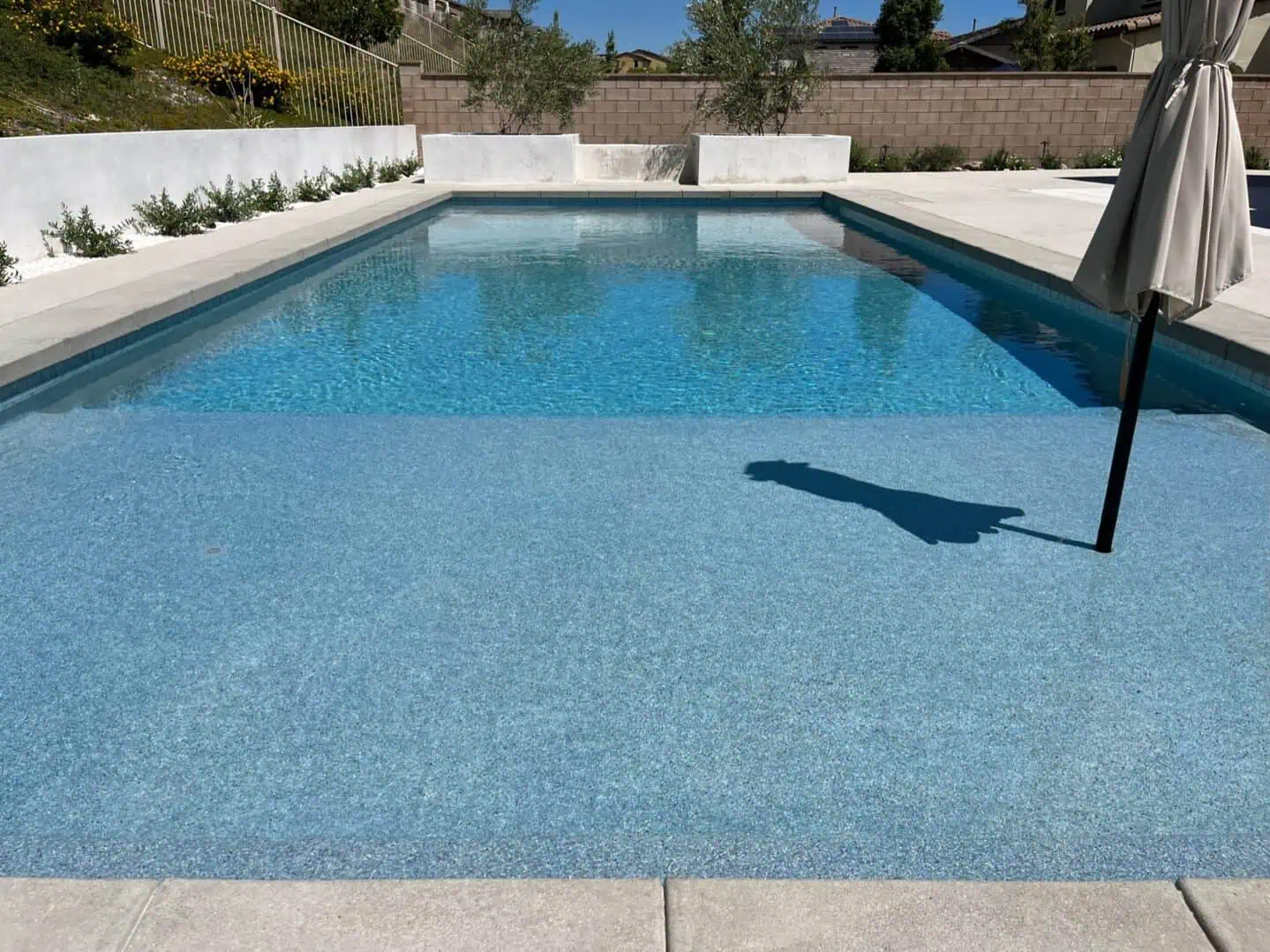 A person standing in the middle of an empty pool.