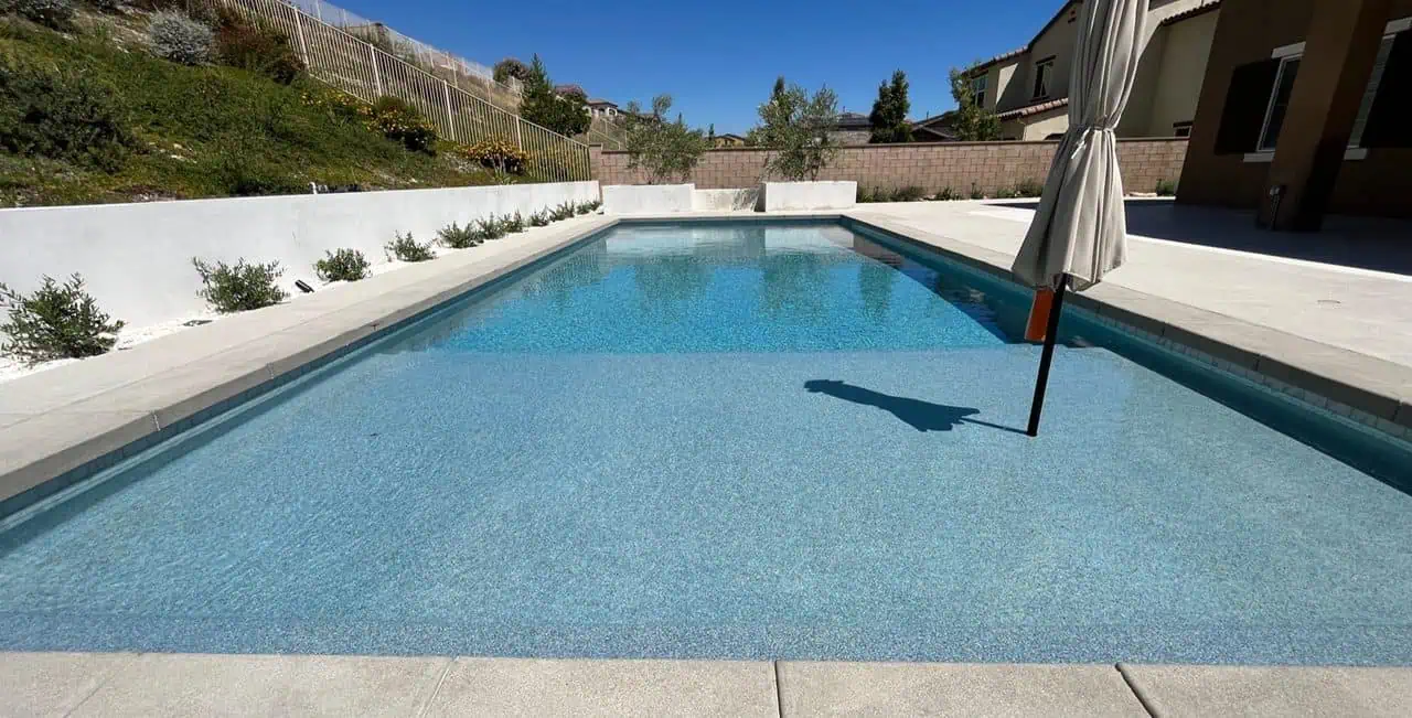 A person standing in the middle of an empty pool.