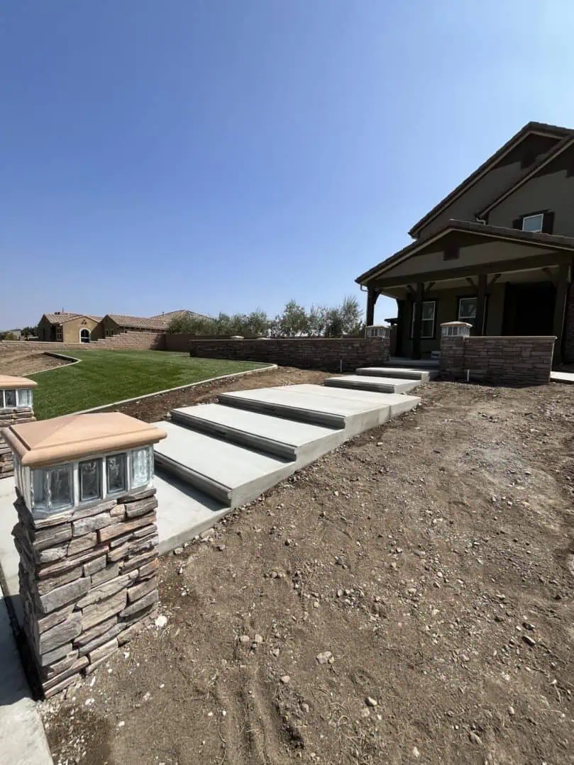 A house with steps leading to the ground.