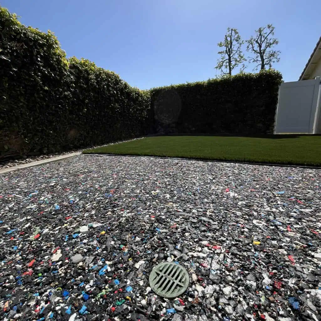 Recycled material surface in sunny backyard.