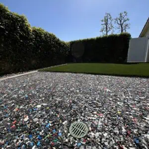 Recycled material surface in sunny backyard.