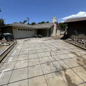 Newly laid concrete driveway under construction.