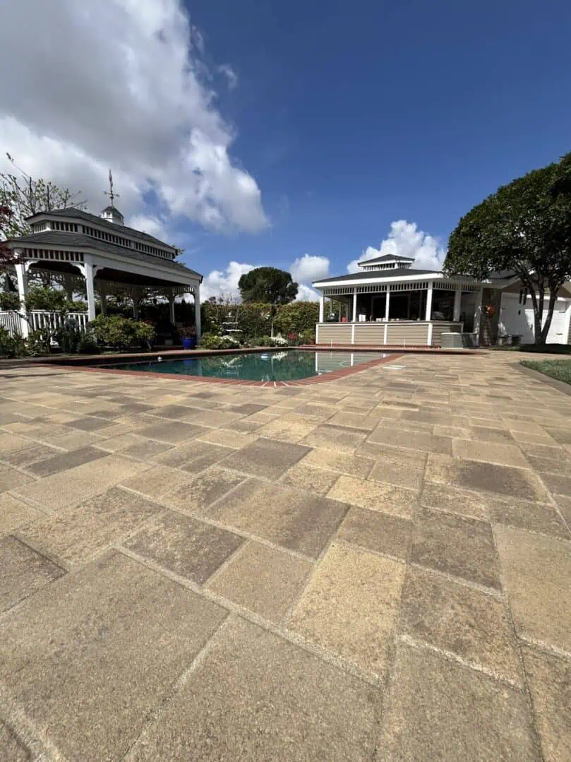 Spacious patio with gazebos and clear sky.